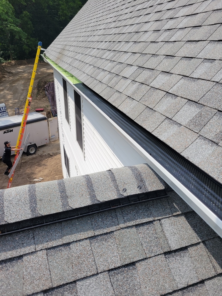 gutter contractors installing leaf protection
